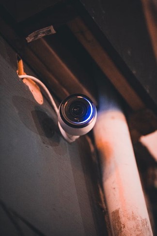 An image of a cctv camera wired into a building