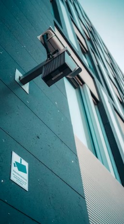 An image of a cctv camera fixed onto a building